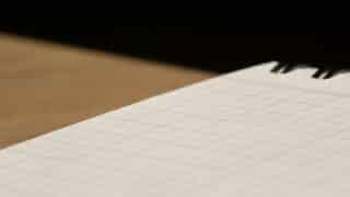 Gridded notebook on table