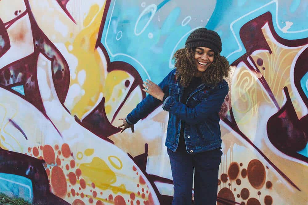 excited woman with graffiti