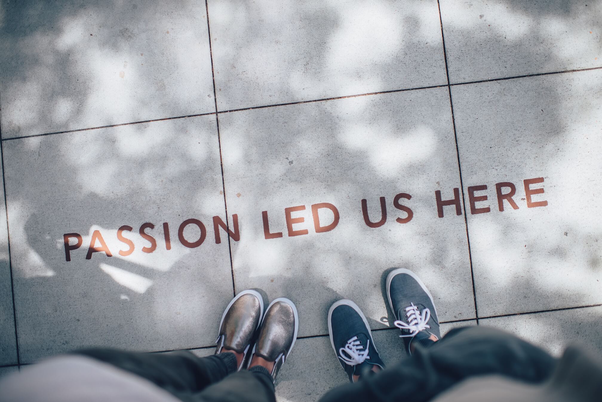 passion led us here writing on sidewalk