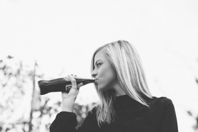 Girl drinking Coke