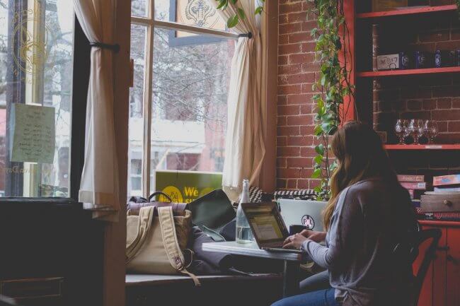 working on laptop in a coffee shop