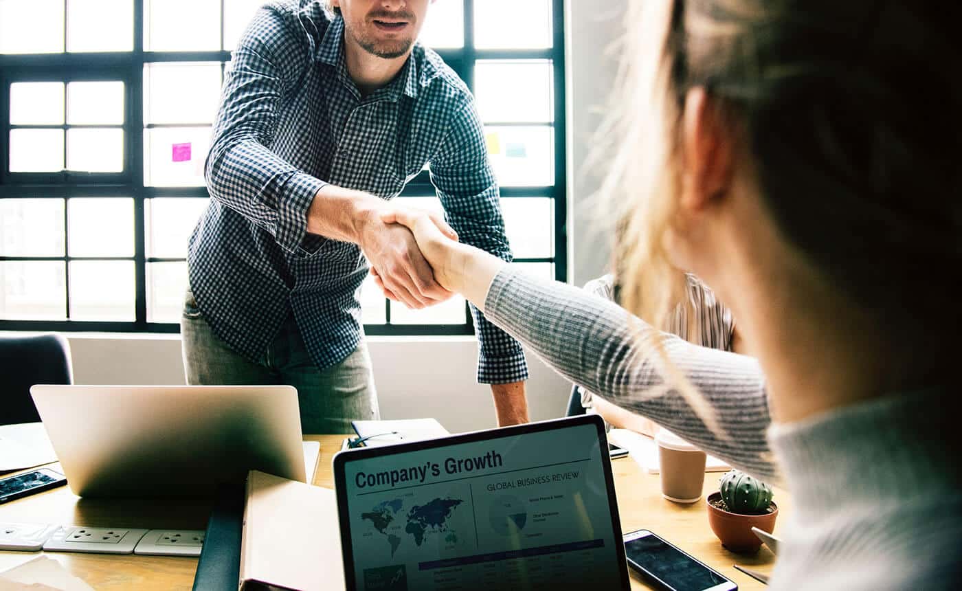 Shaking hands across the table