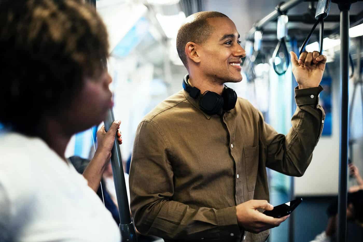 man smiling on subway