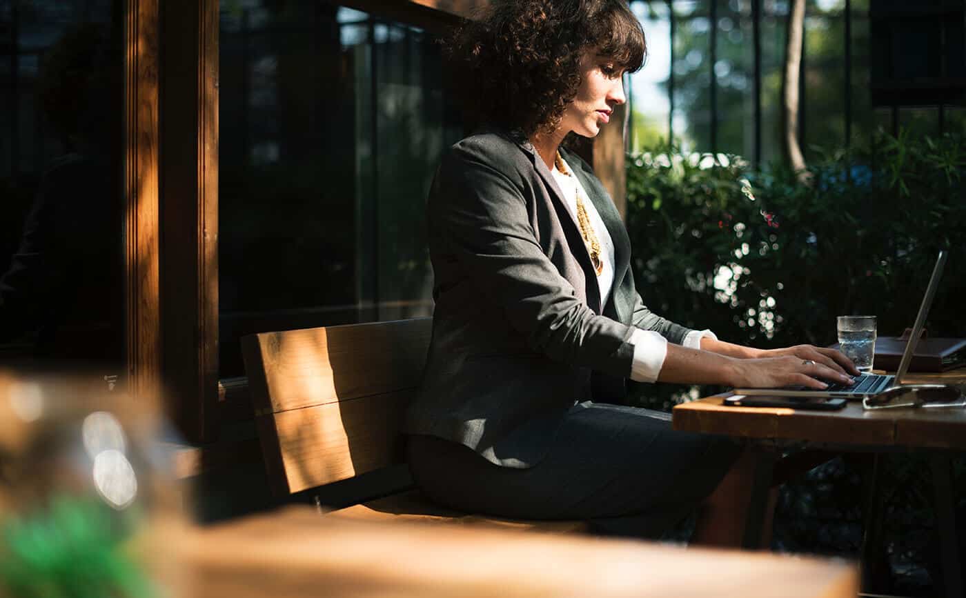 woman working at a table outside