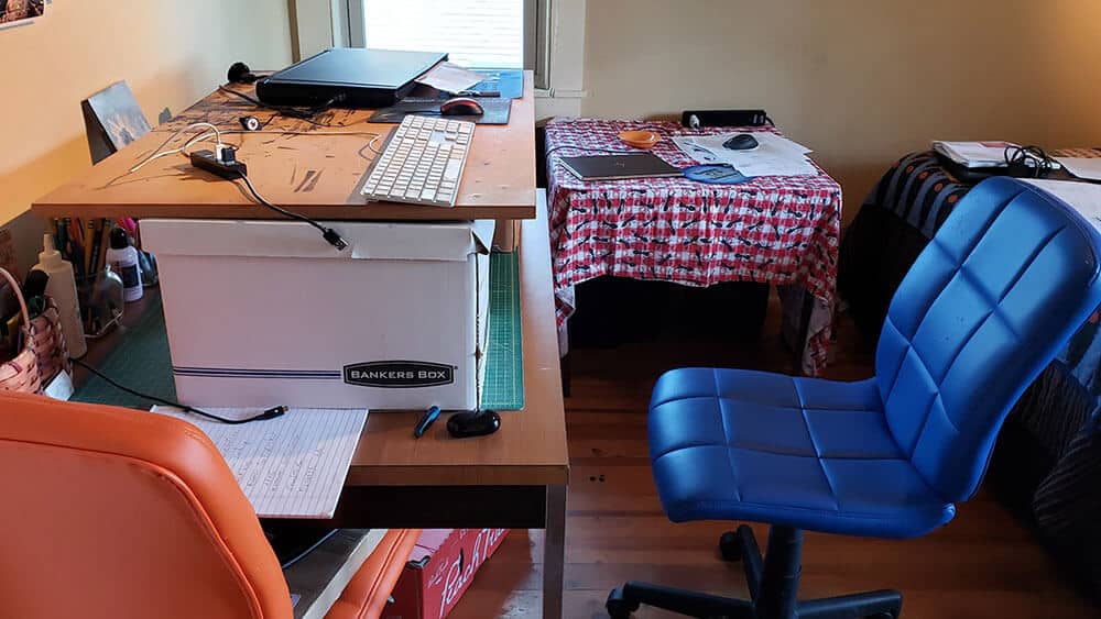 DIY standing desk using bankers boxes and piece of wood